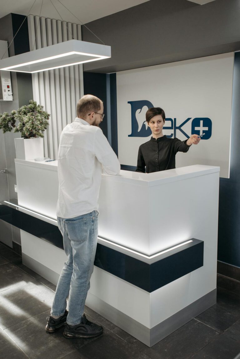 Dental Clinic Receptionist with Patient